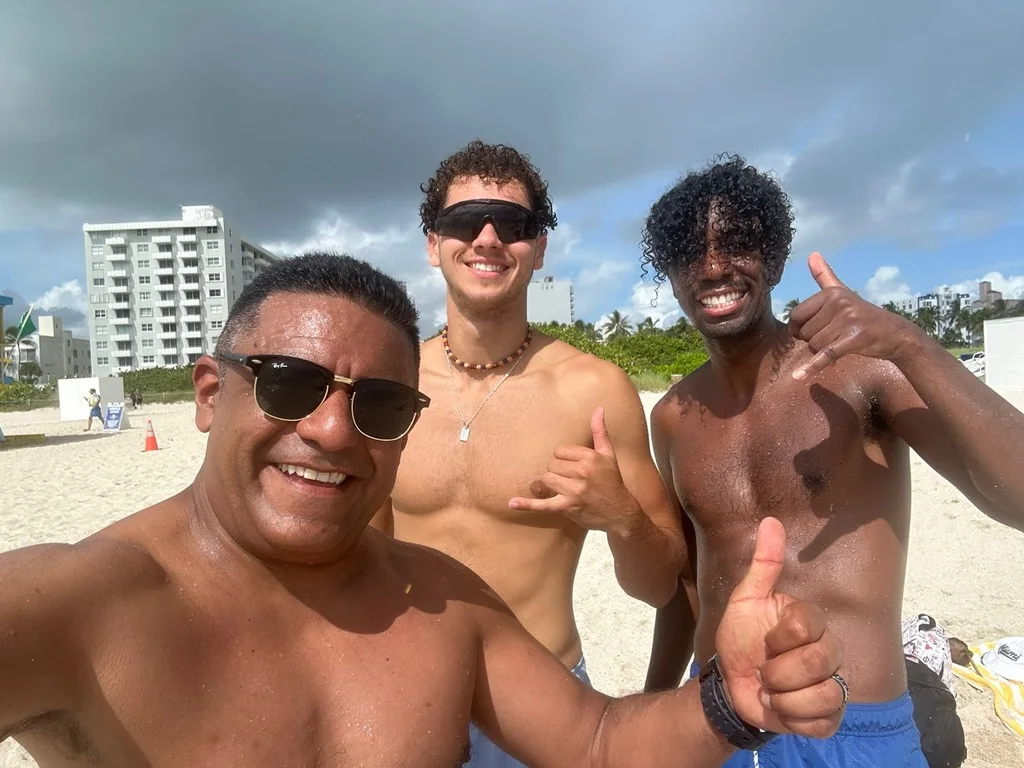 Fidel with travelers on a Brazilian beach